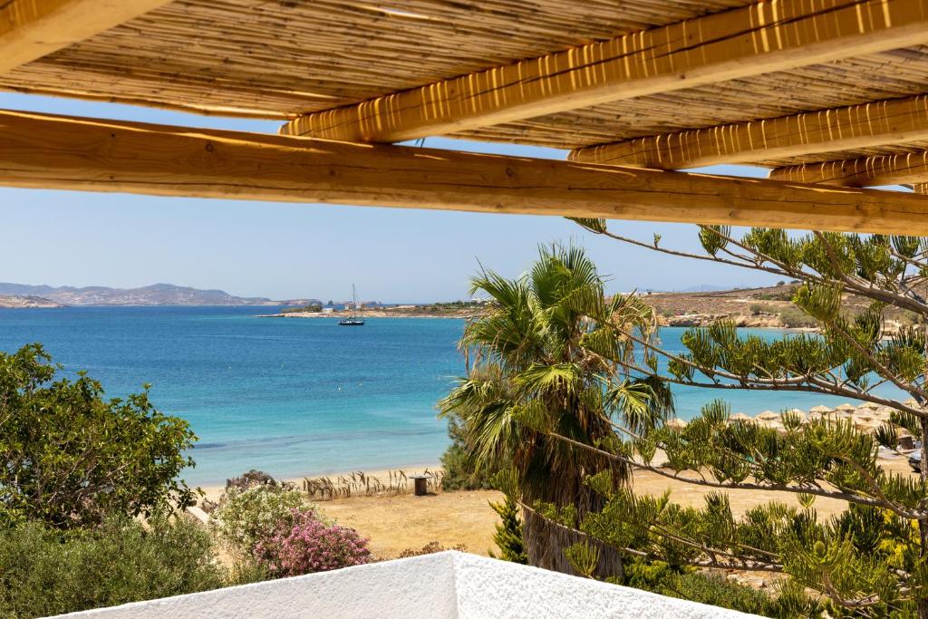 Traditional Paros beach house with whitewashed walls and blue shutters